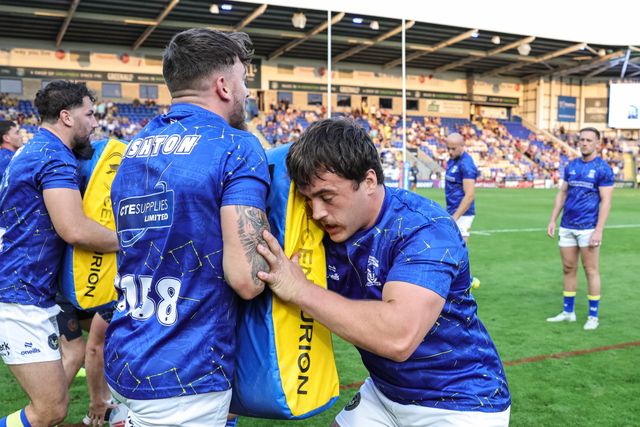 Matty Ashton of Warrington Wolves and Max Wood of Warrington Wolves in the pre-game warm up during the Betfred Super League round 23 match Warrington Wolves vs York Knights at The Halliwell Jones Stadium, Warrington, United Kingdom on 13 August 2026

(Photo by Mark Cosgrove/News Images)