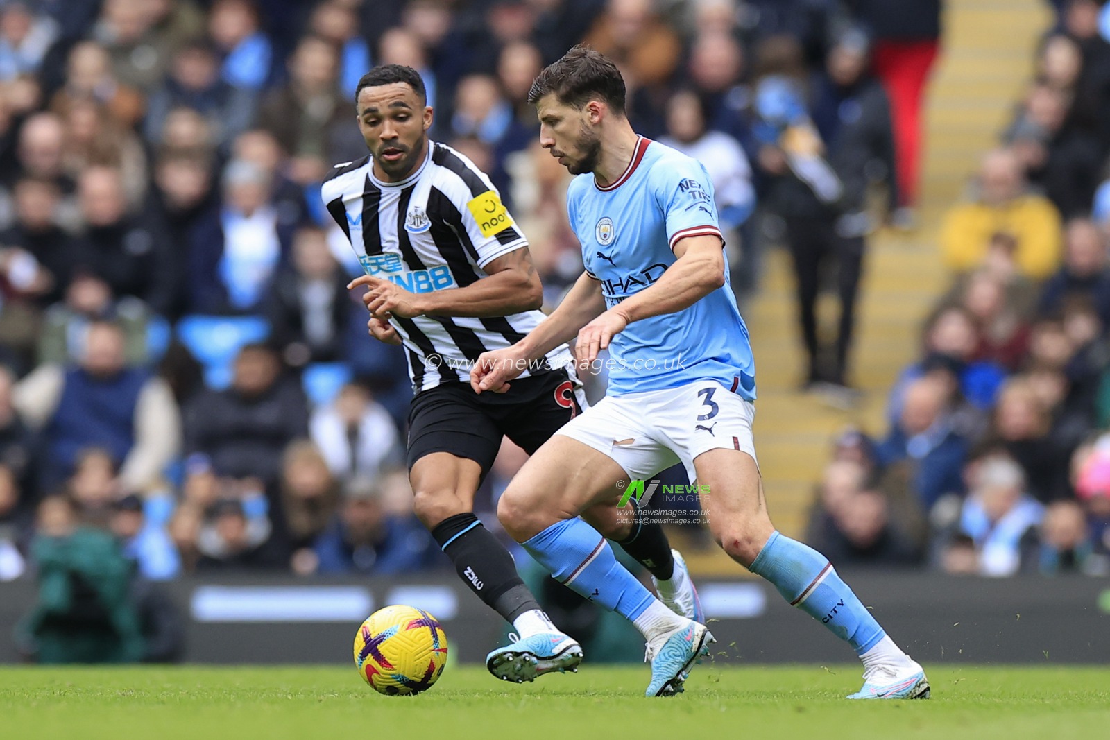 Ruben Dias #3 of Manchester City runs with the ball and is faced by Callum Wilson #9 of Newcastle United during the Premier League match Manchester City vs Newcastle United at Etihad Stadium, Manchester, United Kingdom, 4th March 2023

(Photo by Conor Molloy/News Images)