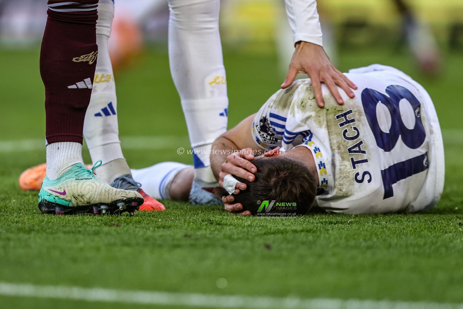 Anton Stach of Leeds United injured after heading the ball towards goal during the Premier League match Leeds United vs Aston Villa at Elland Road, Leeds, United Kingdom, 23rd November 2025

(Photo by Alfie Cosgrove/News Images)

*** GER AUT SUI OUT ***