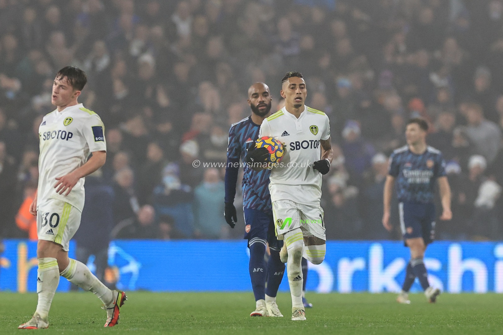 Raphinha #10 of Leeds United races the ball back to the centre sport after scoring to make it 1-3