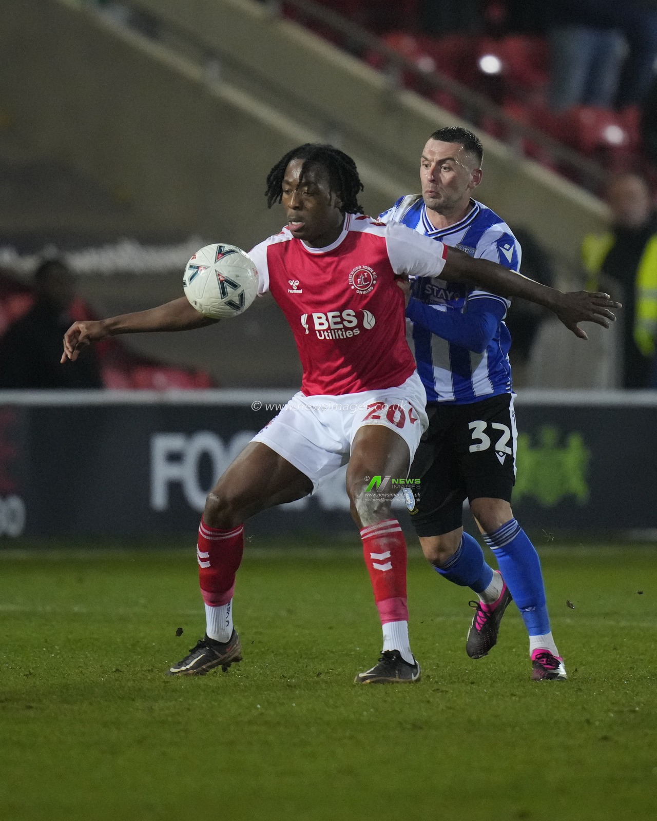 Promise Omochere #20 of Fleetwood Town shields the ball from Jack Hunt #32 of Sheffield Wednesday during the Emirates FA Cup Fourth Round Reply match Fleetwood Town vs Sheffield Wednesday at Highbury Stadium, Fleetwood, United Kingdom, 7th February 2023

(Photo by Steve Flynn/News Images)