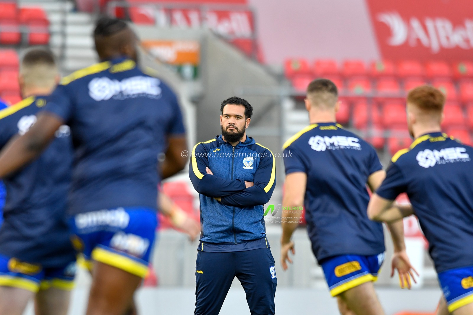 Ben Murdoch-Masila (13) of Warrington Wolves assists with the warm up tonight