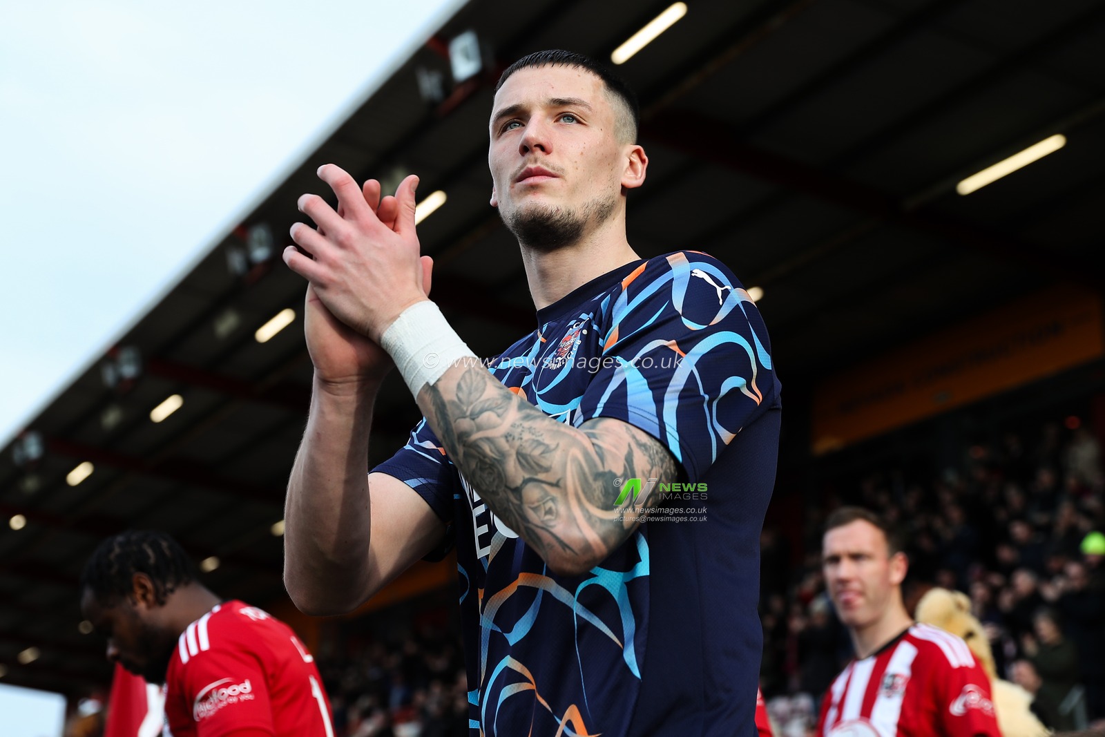 Oliver Casey of Blackpool applauds the travelling fans during the Sky Bet League 1 match Exeter City vs Blackpool at St James' Park, Exeter, United Kingdom, 25th January 2025

(Photo by Gareth Evans/News Images)