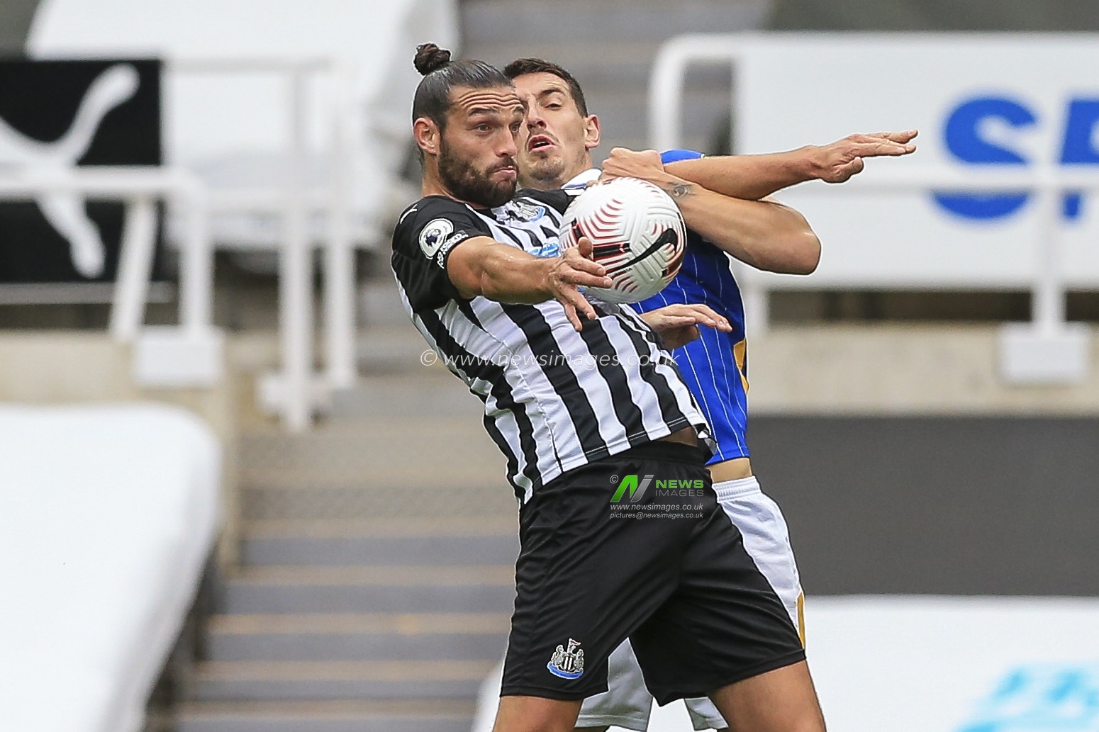Andy Carroll (7) of Newcastle United controls the ball with his chest