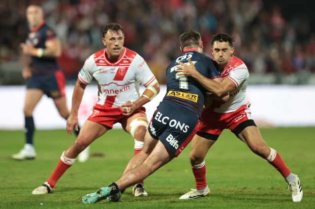 Jack Welsby of St. Helens is tackled by Arthur Mourgue of Hull KR during the Betfred Super League Round 24 match Hull KR vs St Helens at Sewell Group Craven Park, Kingston upon Hull, United Kingdom, 29th August 2025

(Photo by Mark Cosgrove/News Images)