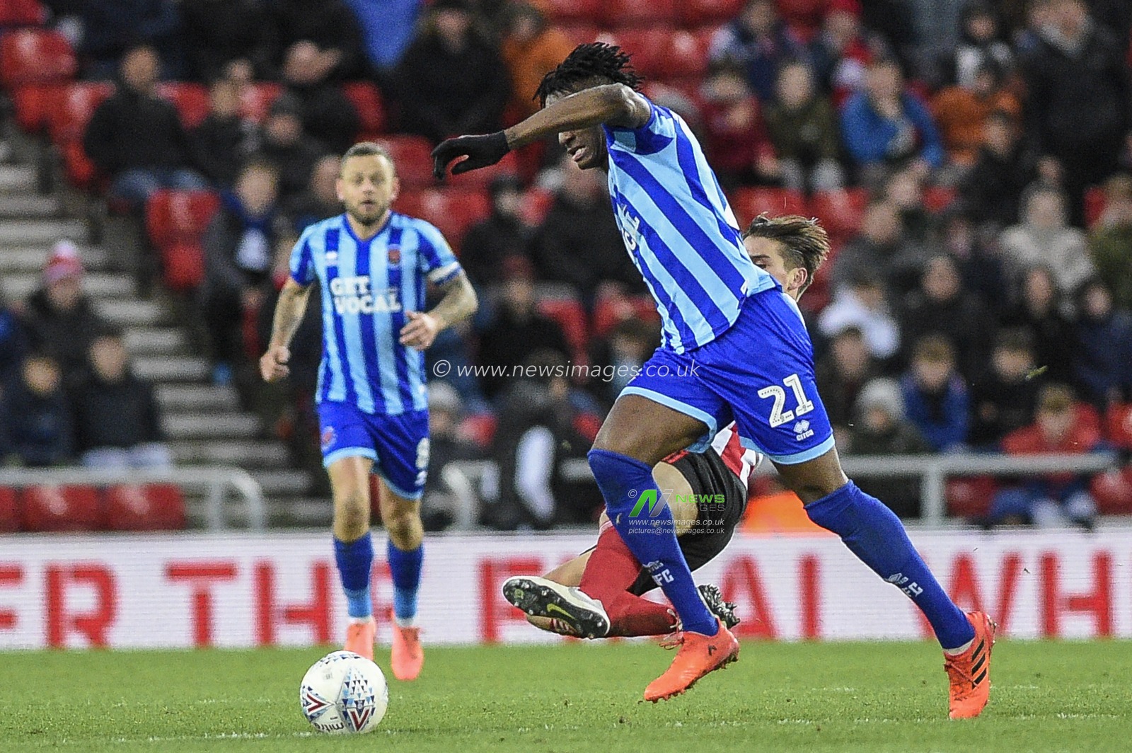 14th December 2019, Stadium Of Light, Sunderland, England; Sky Bet League 1, Sunderland v Blackpool : George Dobson (18) of Sunderland fouls Armand Gnanduillet (21) of Blackpool

Credit: Iam Burn/News Images