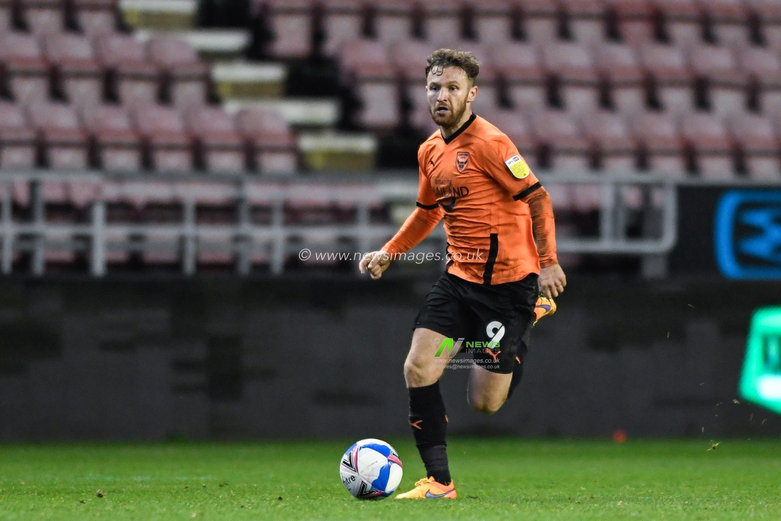 Matty Taylor #9 of Oxford United runs forward with the ball