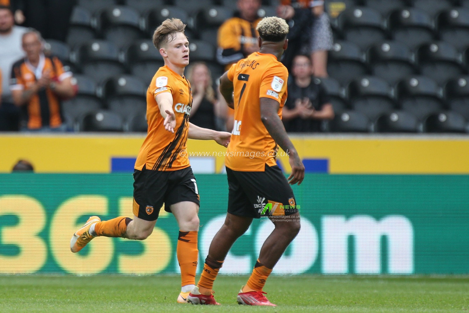Keane Lewis-Potter #11 of Hull City is congratulated by Mallik Wilks #7 of Hull City