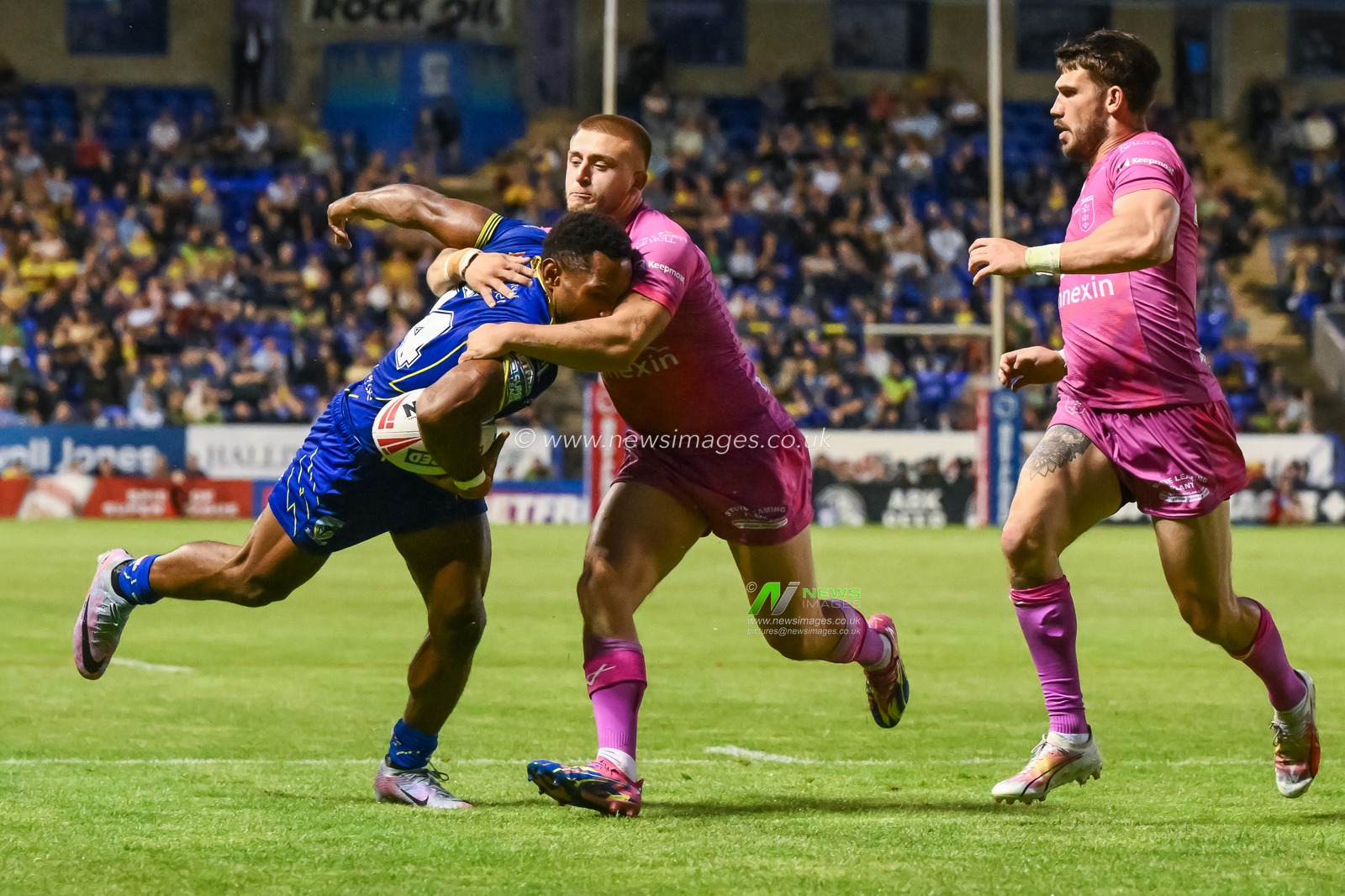 Rodrick Tai of Warrington Wolves is tackled by Mikey Lewis of Hull KR during the Betfred Super League Round 20 match Warrington Wolves vs Hull KR at Halliwell Jones Stadium, Warrington, United Kingdom, 2nd August 2024

(Photo by Craig Thomas/News Images)