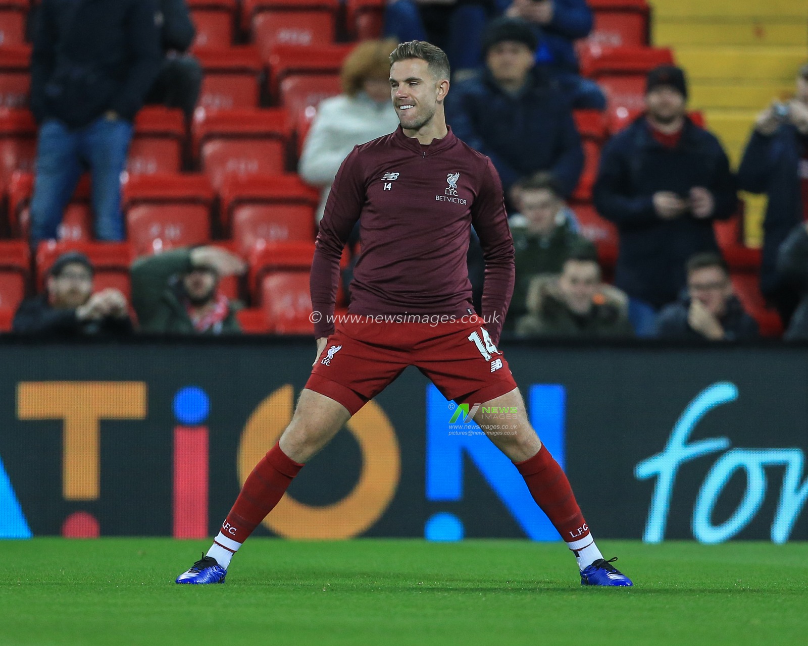 11th December 2018, Anfield, Liverpool, England; UEFA Champions League, Liverpool v Napoli ; Jordan Henderson (14) of Liverpool  warming up 


  Credit: Mark Cosgrove/News Images