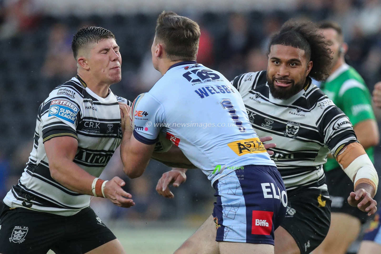 Jack Welsby #1 of St Helens is tackled by Chris Satae #10 of Hull FC and Joe Cator #15 of Hull FC during the Betfred Super League Round 16 match Hull FC vs St Helens at MKM Stadium, Hull, United Kingdom, 22nd June 2023

(Photo by James Heaton/News Images)