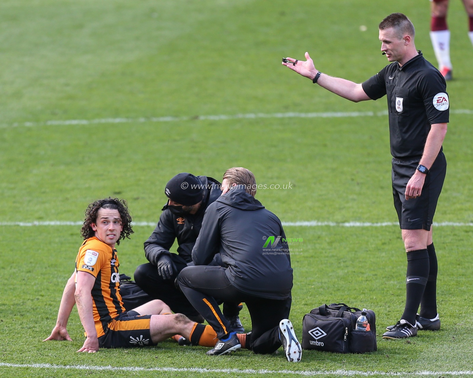 George Honeyman #10 of Hull City receives medical attention late in the game