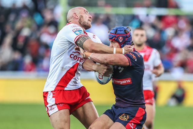 Harry Robertson of St. Helens is tackled by Dean Hadley of Hull KR during the Betfred Super League Semi Final 2 match Hull KR vs St Helens at Sewell Group Craven Park, Kingston upon Hull, United Kingdom, 3rd October 2025

(Photo by Alfie Cosgrove/News Images)