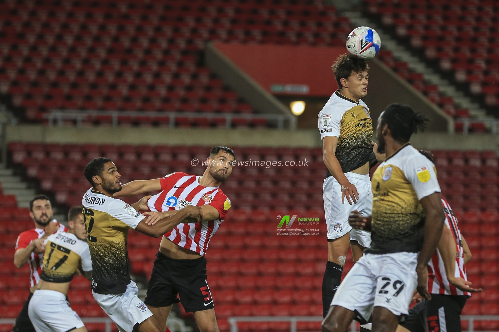 Perry Ng (2) of Crewe Alexandra heads the ball clear of the Crewe Alexandra penalty area