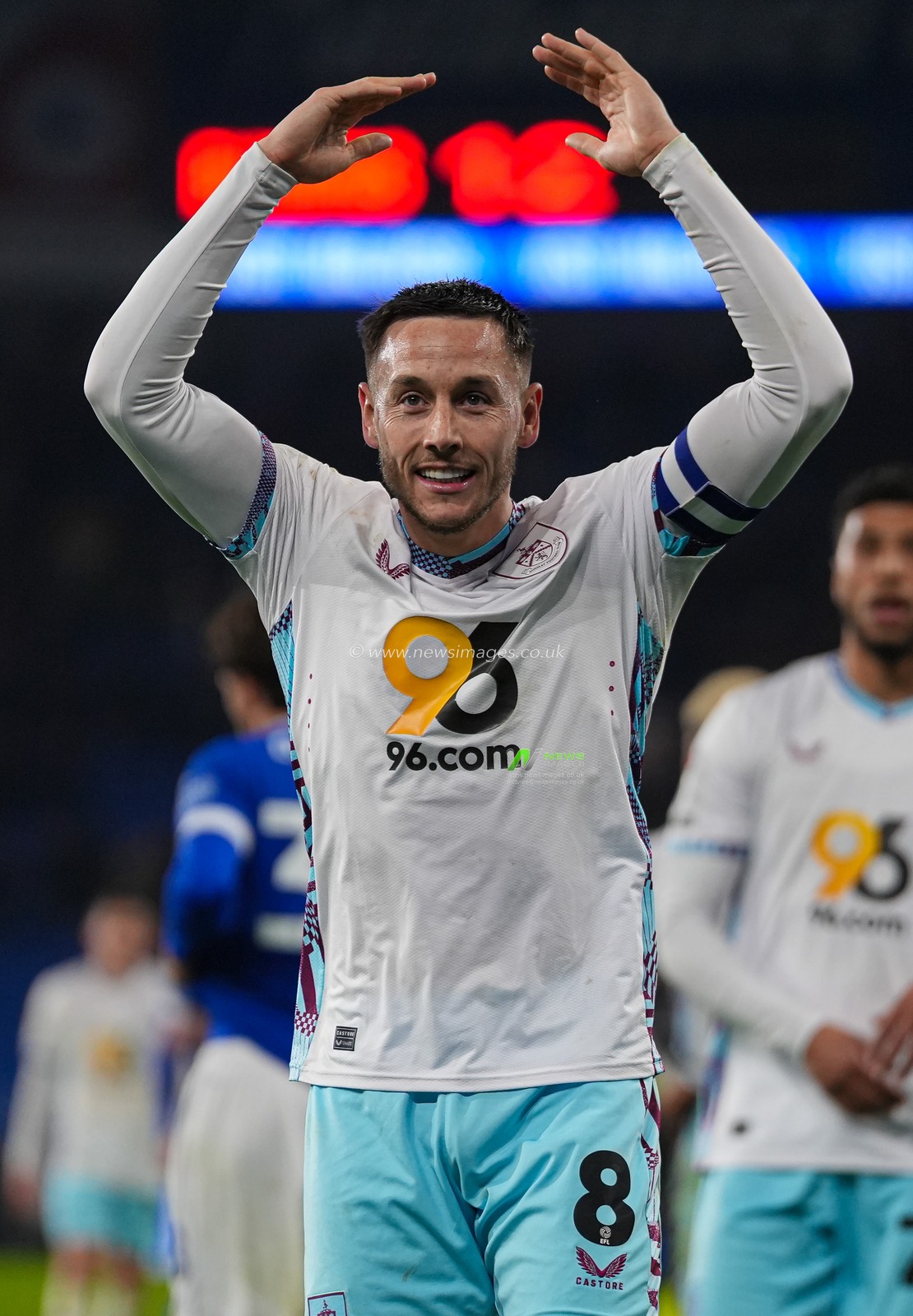 Josh Brownhill of Burnley celebrates with the Burnley fans at the final whistle of the Sky Bet Championship match Cardiff City vs Burnley at Cardiff City Stadium, Cardiff, United Kingdom, 4th March 2025

(Photo by Andrew Lewis/News Images)