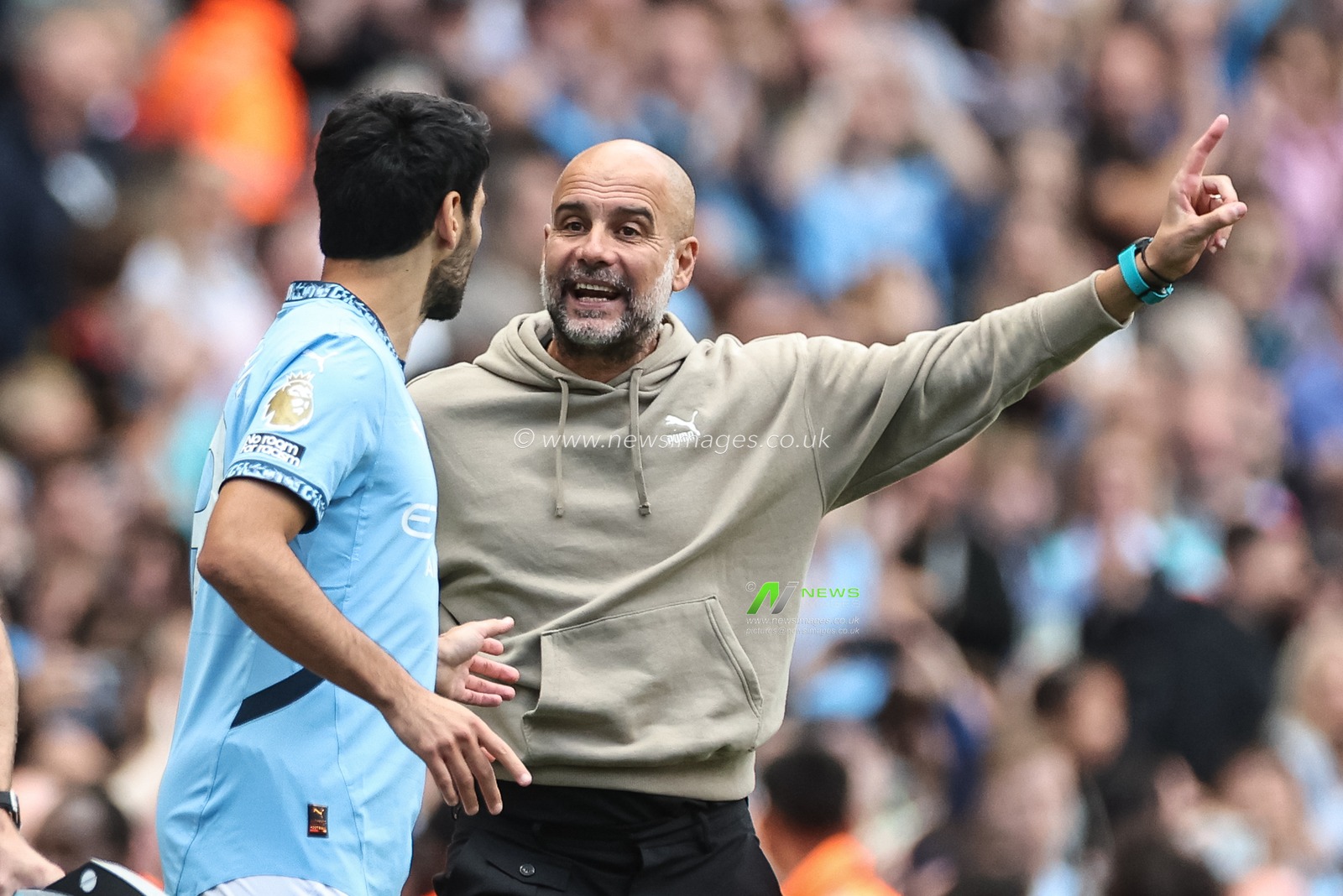 Pep Guardiola manager of Manchester City gives instruction to Ä°lkay GÃ¼ndoÄŸan of Manchester City as he prepares to come on during the Premier League match Manchester City vs Ipswich Town at Etihad Stadium, Manchester, United Kingdom, 24th August 2024

(Photo by Mark Cosgrove/News Images)