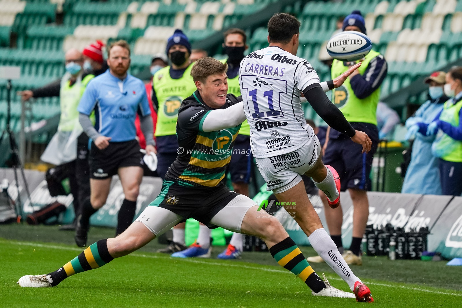 Tommy Freeman #11 of Northampton Saints battles with  Santiago Carreras #11 of Gloucester Rugby