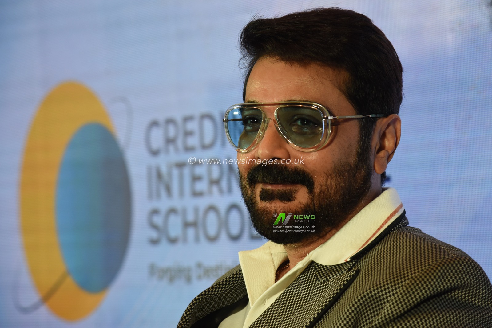 Indian Actor Prosenjit Chatterjee react at the media conferences during Credmont International School announced its entry into Kolkata, promising to redefine the cityâ€™s educational landscape. Located at Kolkata West International City, Howrah, the sprawling 3.3-acre campus is set to provide a world-class learning environment with cutting-edge facilities. What sets Credmont apart from other CBSE schools is its integration of advanced artificial intelligence (AI) technology into every aspect of teaching and learning. From AI-powered smartboards and interactive classrooms to AI-enabled labs, the school leverages cutting-edge tools to provide personalized learning experiences tailored to each student's needs. This innovation ensures a future-ready education, making Credmont a unique and forward-thinking choice for parents. The annual fee is â‚¹3,00,000, inclusive of all facilities and services.  In Kolkata on December 11,2024,Pictures by Debajyoti Chakraborty.(Photo: Debajyoti Chakraborty/News Images)