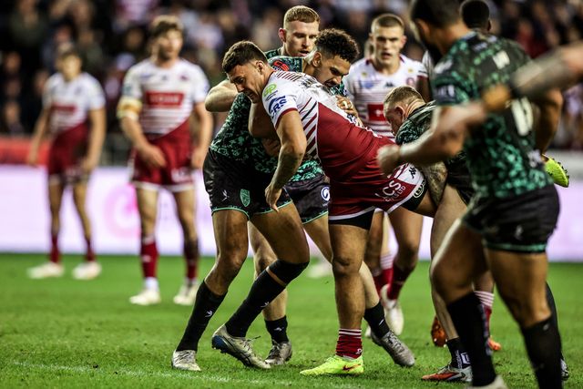 Oliver Partington of Wigan Warriors is tackled by Jacob Alick-Wiencke of Leigh Leopards and Josh Charnley of Leigh Leopards during the Betfred Super League match Wigan Warriors vs Leigh Leopards at The Brick Community Stadium, Wigan, United Kingdom on 26 February 2026

(Photo by Alfie Cosgrove/News Images)