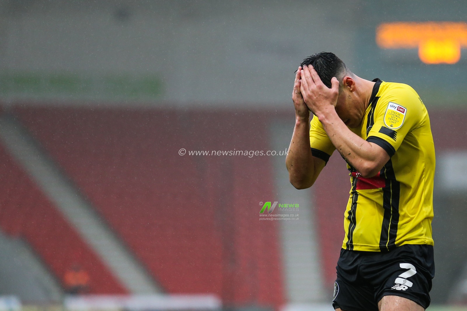 Ryan Fallowfield (2) of Harrogate Town puts his hands to his head in frustration