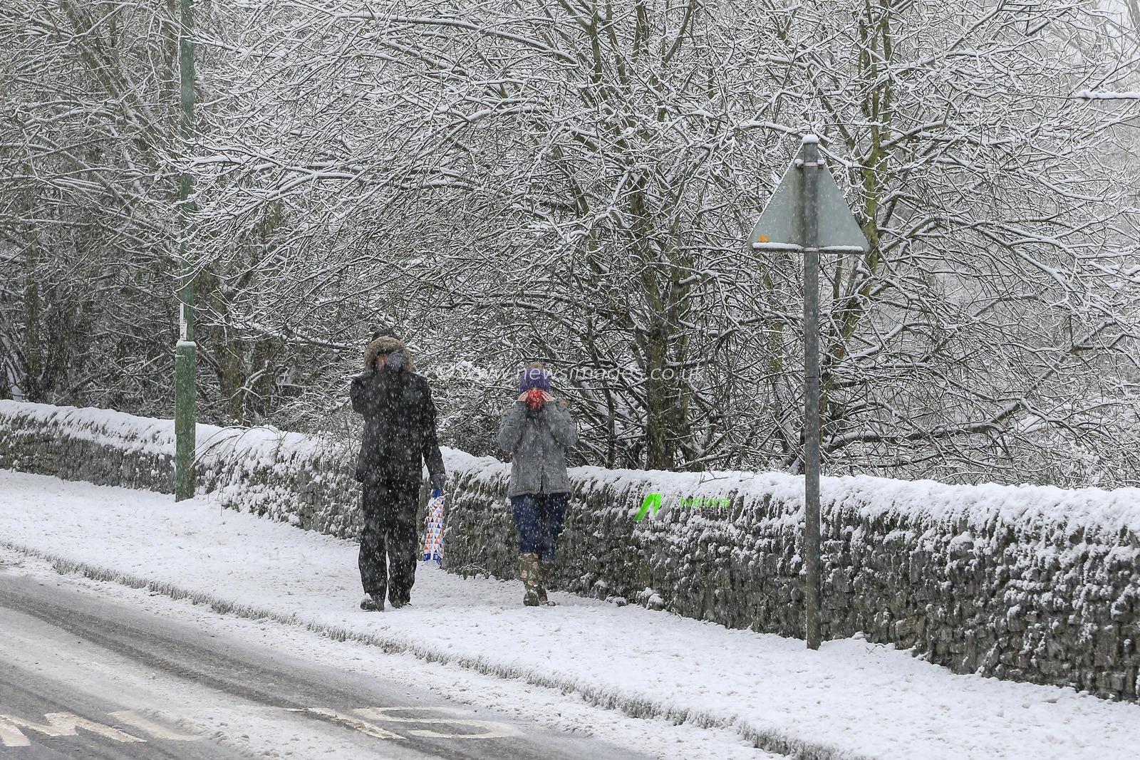 Two people out walking in the snow in Shotley Bridge, County Durham, as adverse weather hits the area