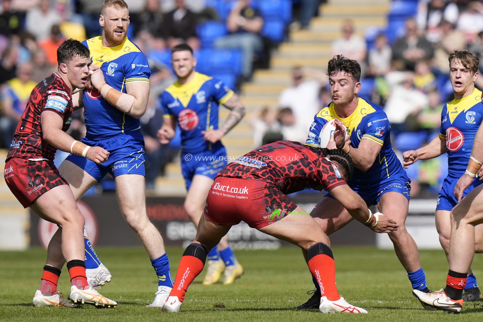 Jordy Crowther of Warrington Wolves runs at Tom Amone of Leigh Leopards during the Betfred Super League Round 8 match Warrington Wolves vs Leigh Leopards at Halliwell Jones Stadium, Warrington, United Kingdom, 20th April 2024

(Photo by Steve Flynn/News Images)