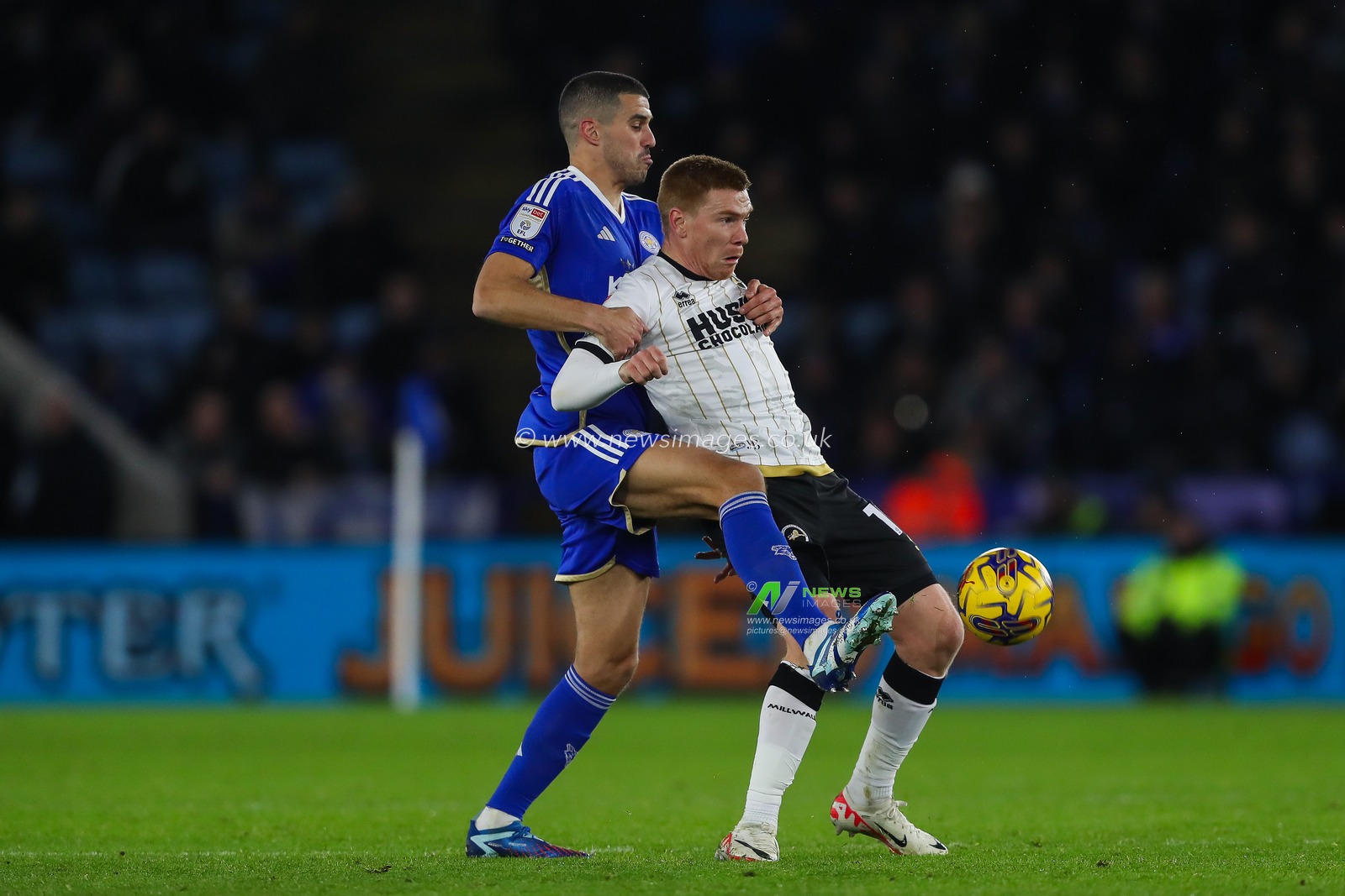Conor Coady #4 of Leicester City and Duncan Watmore #19 of Millwall battle for the ball during the Sky Bet Championship match Leicester City vs Millwall at King Power Stadium, Leicester, United Kingdom, 13th December 2023

(Photo by Gareth Evans/News Images)