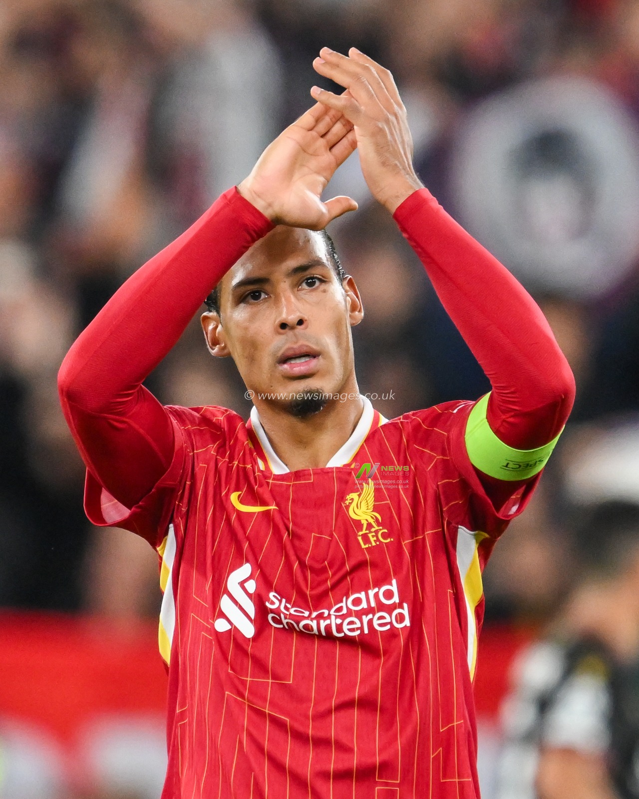 Virgil van Dijk of Liverpool acknowledges the fans after the teams victory following the UEFA Champions League  - League Stage match Liverpool vs Bologna at Anfield, Liverpool, United Kingdom, 2nd October 2024

(Photo by Craig Thomas/News Images)