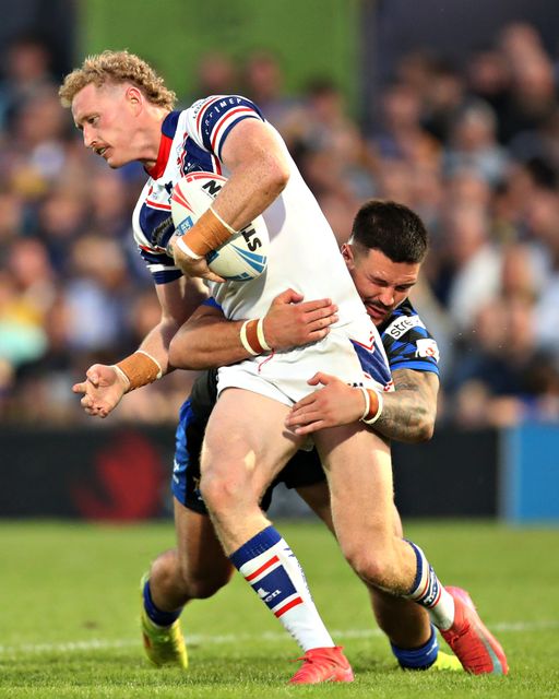 James Bentley of Leeds Rhinos tackles Lachlan Walmsley of Wakefield Trinity during the Betfred Super League round 20 match Wakefield Trinity vs Leeds Rhinos at DIY Kitchens Stadium, Wakefield, United Kingdom, 24th July 2025(Photo by Sam Eaden/News Images)