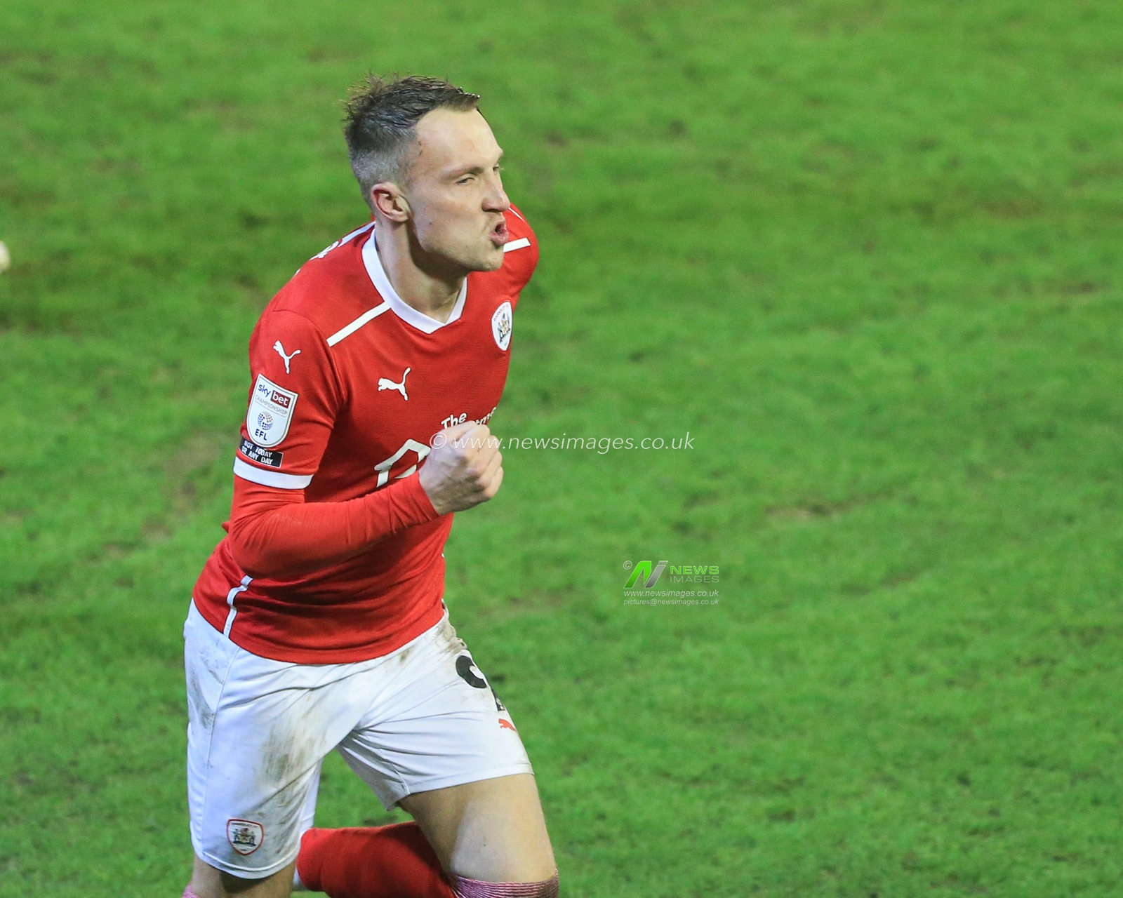 Cauley Woodrow #9 of Barnsley celebrates his goal to make it 2-0