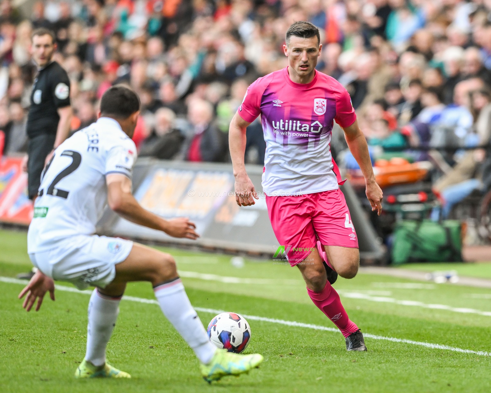 Matty Pearson #4 of Huddersfield Townmakes a break with the ball during the game during the Sky Bet Championship match Swansea City vs Huddersfield Town at Swansea.com Stadium, Swansea, United Kingdom, 15th April 2023

(Photo by Craig Thomas/News Images)