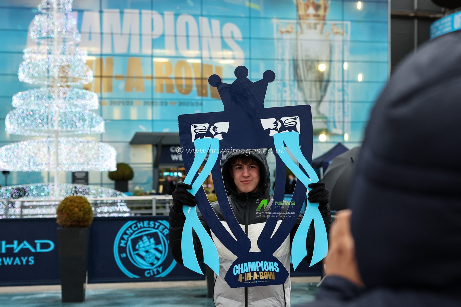 A fan has his picture taken during the Premier League match Manchester City vs Tottenham Hotspur at Etihad Stadium, Manchester, United Kingdom, 23rd November 2024

(Photo by Mark Cosgrove/News Images)