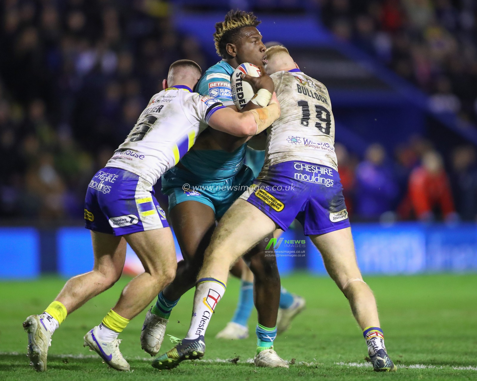 Danny Walker #16 of Warrington Wolves and Joe Bullock #19 of Warrington Wolves tackle Justin Sangare #17 of Leeds Rhinos during the Betfred Super League Round 1 match Warrington Wolves vs Leeds Rhinos at Halliwell Jones Stadium, Warrington, United Kingdom, 16th February 2023

(Photo by Gareth Evans/News Images)