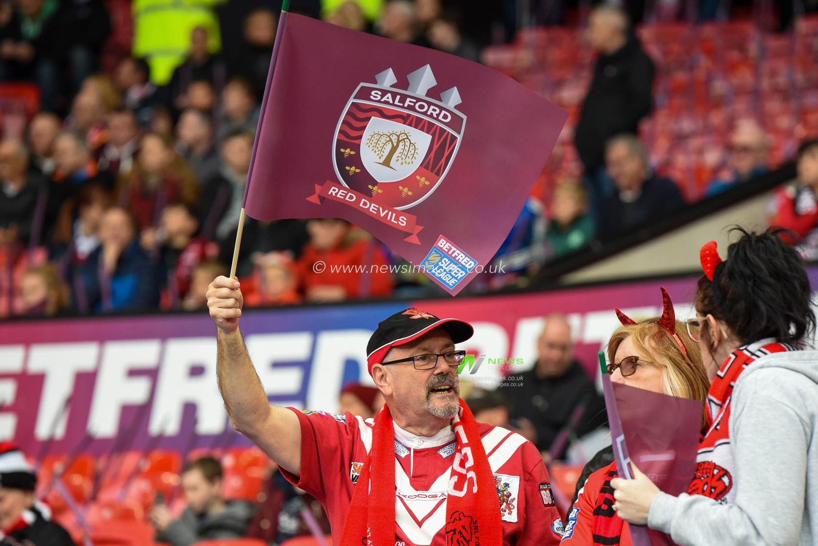 12th October 2019, Old Trafford, Manchester, England; The Grand Final 2019, Saint Helens v Salford Red Devils : A Salford Red Devils fan waves his flag

Credit: Simon Whitehead/News Images
