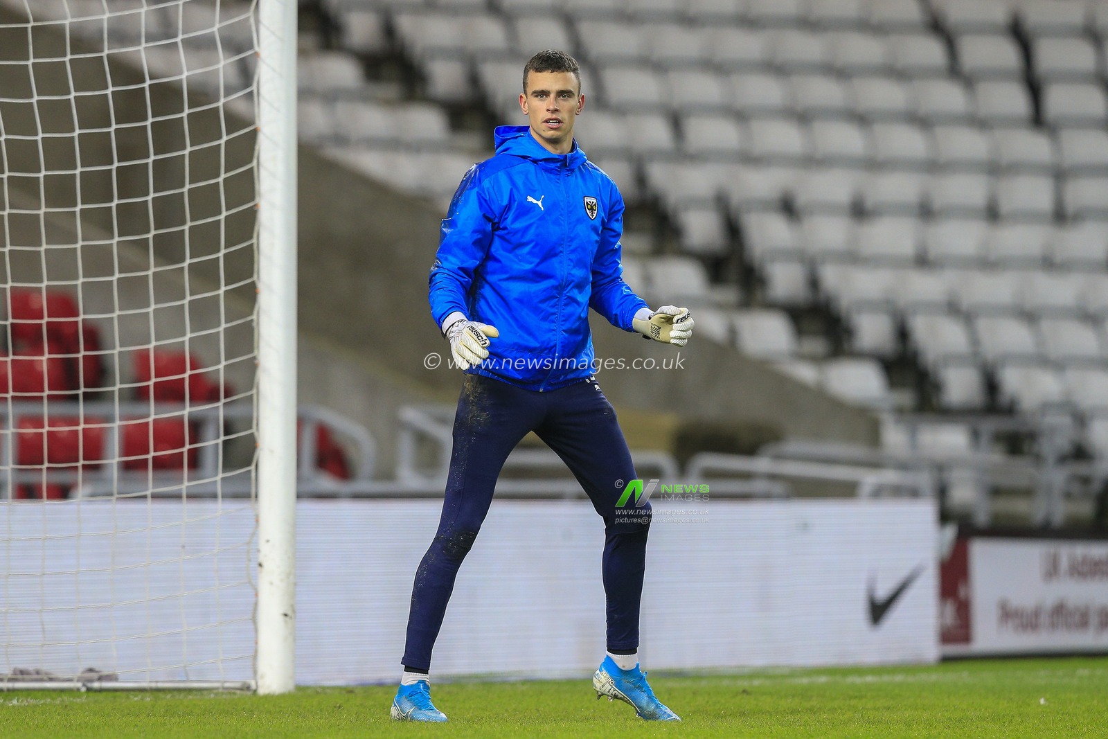 Nik Tzanev #13 of AFC Wimbledon during the pre-game warmup