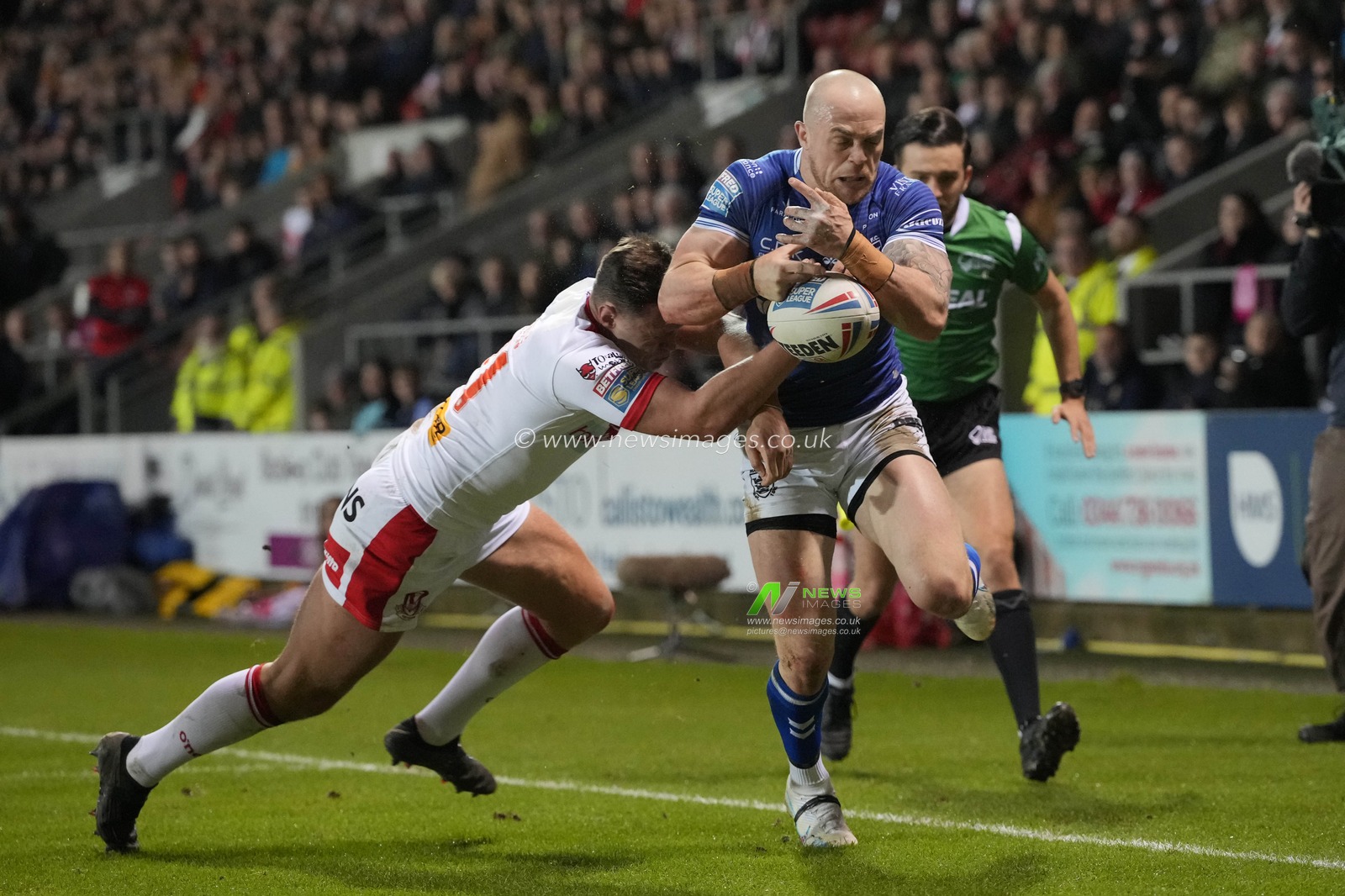 Adam Swift #2 of Hull FC is tackled by Ben Davies #21 of St Helens during the Betfred Super League Round 5 match St Helens vs Hull FC at Totally Wicked Stadium, St Helens, United Kingdom, 17th March 2023

(Photo by Steve Flynn/News Images)