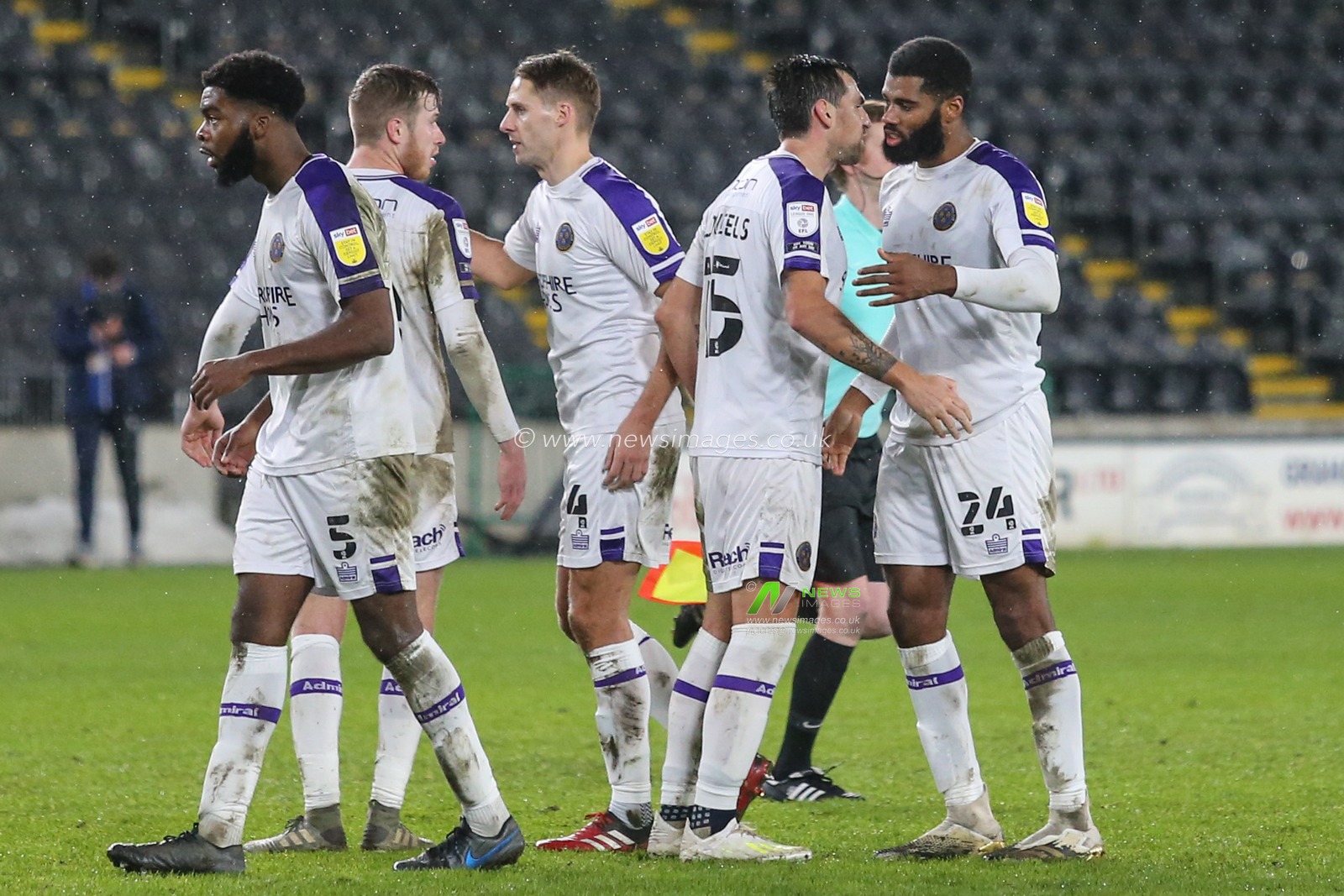 Shrewsbury Town players celebrate the win after the final whistle