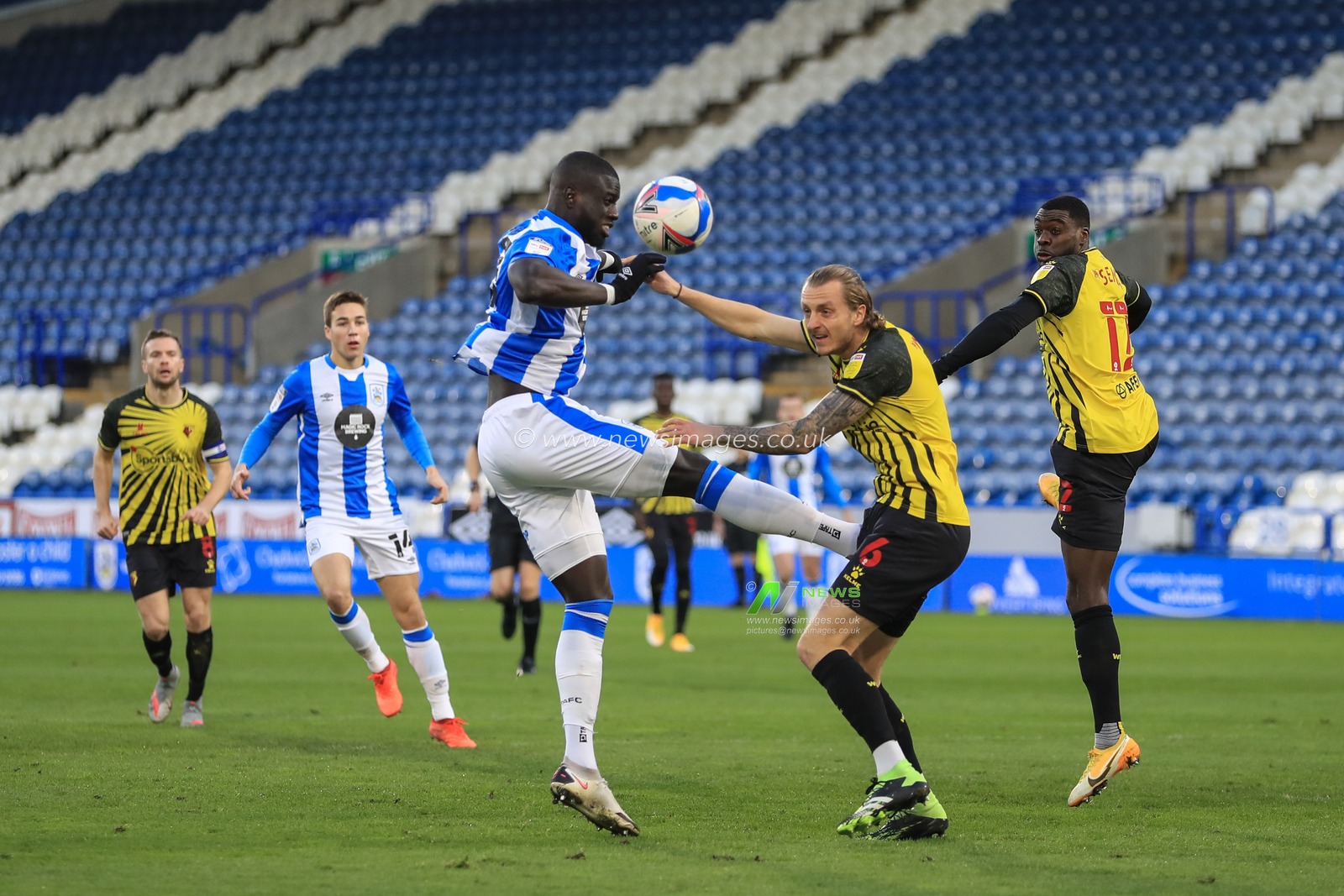 Naby Sarr #23 of Huddersfield Town misses the ball at close range in front of the Watford goal