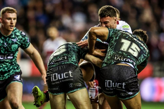 Kaide Ellis of Wigan Warriors is tackled by Bailey Hodgson of Leigh Leopards and Jacob Alick-Wiencke of Leigh Leopards during the Betfred Super League match Wigan Warriors vs Leigh Leopards at The Brick Community Stadium, Wigan, United Kingdom on 26 February 2026

(Photo by Alfie Cosgrove/News Images)