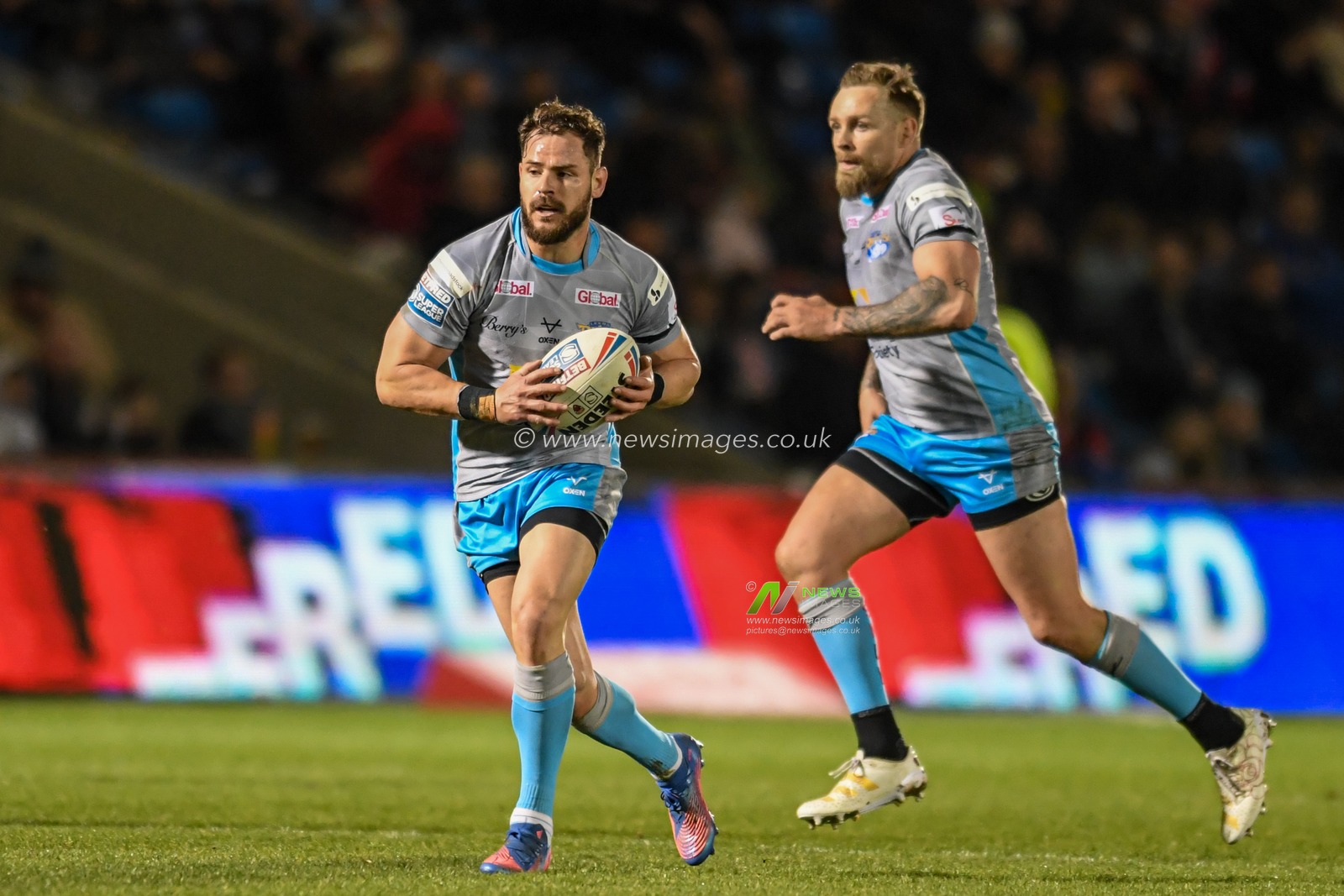 Aidan Sezer #7 of Leeds Rhinos runs forward with the ball