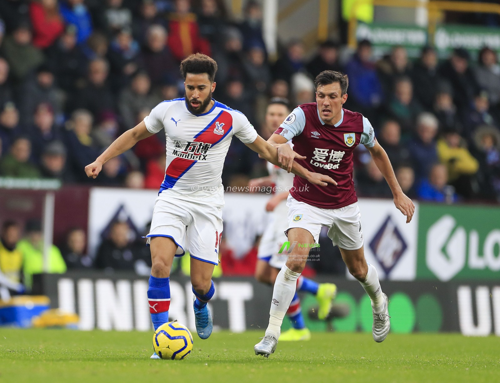 30th November 2019, Turf Moor, Burnley, England; Premier League, Burnley v Crystal Palace : Andros Townsend (10) of Crystal Palace is held back by Jack Cork (4) of Burnley

Credit: Conor Molloy/News Images
