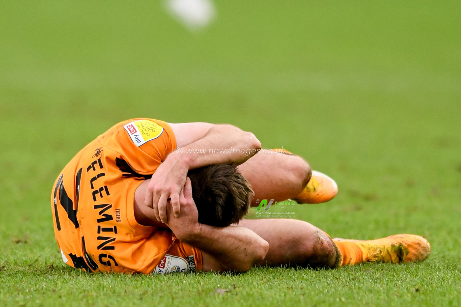 Brandon Fleming #21 of Hull City holds his head after a challenge