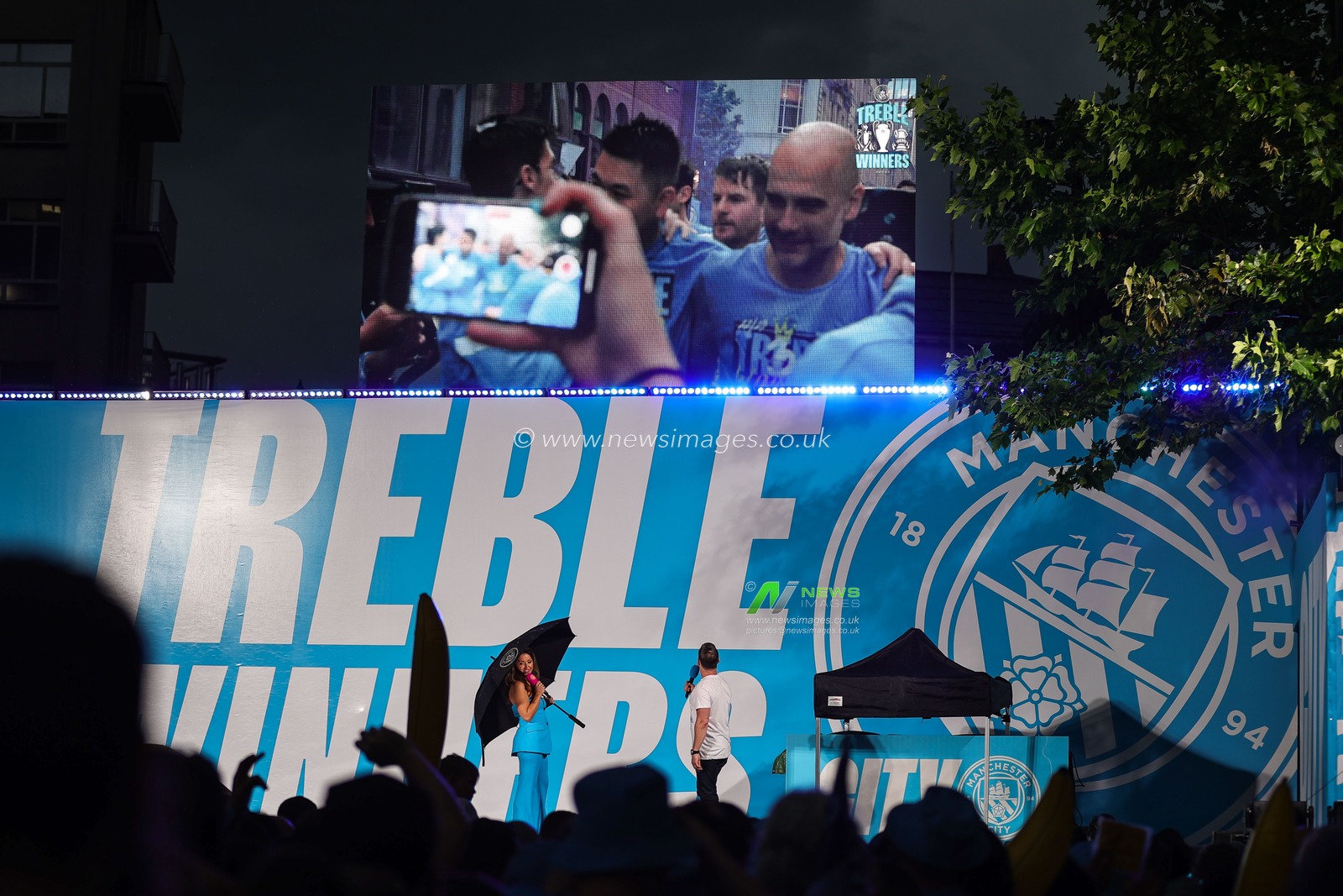 Pep Guardiola manager of Manchester City on the big screen during Manchester City's Treble victory parade at St Peterâ€™s Square, Manchester, United Kingdom, 12th June 2023

(Photo by Mark Cosgrove/News Images)