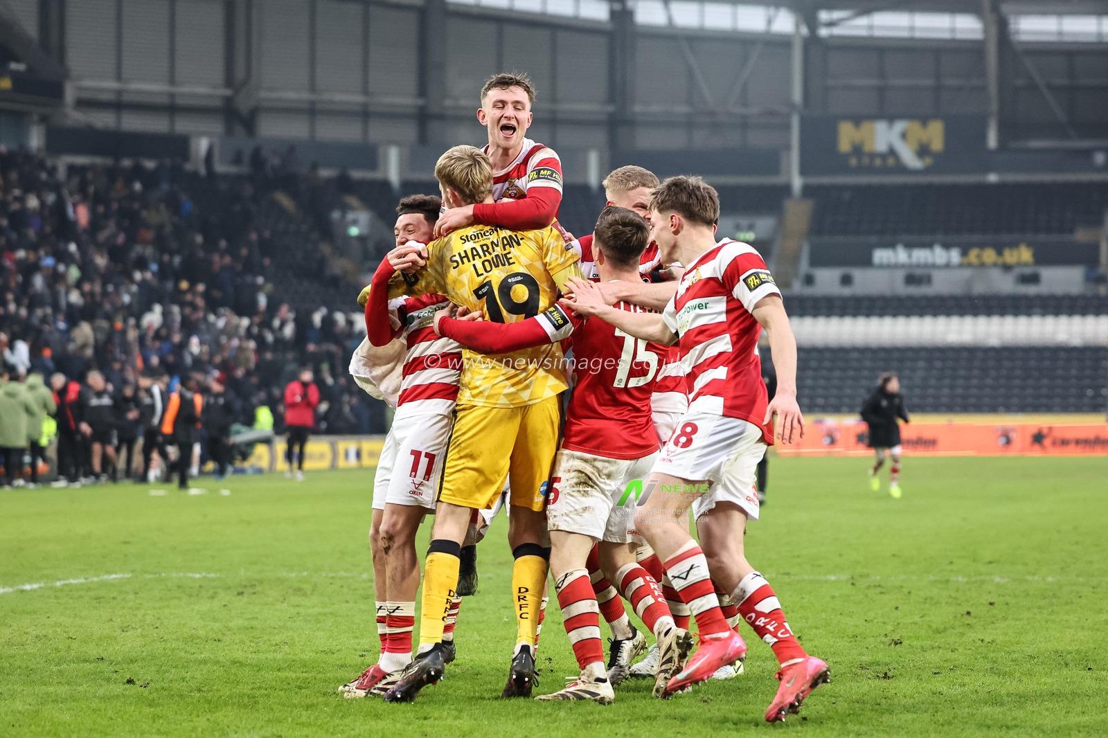 Harry Clifton of Doncaster Rovers and his team mates celebrate winning in a penalty shootout during the Emirates FA Cup 3rd Round match Hull City vs Doncaster Rovers at MKM Stadium, Hull, United Kingdom, 12th January 2025

(Photo by Mark Cosgrove/News Images)