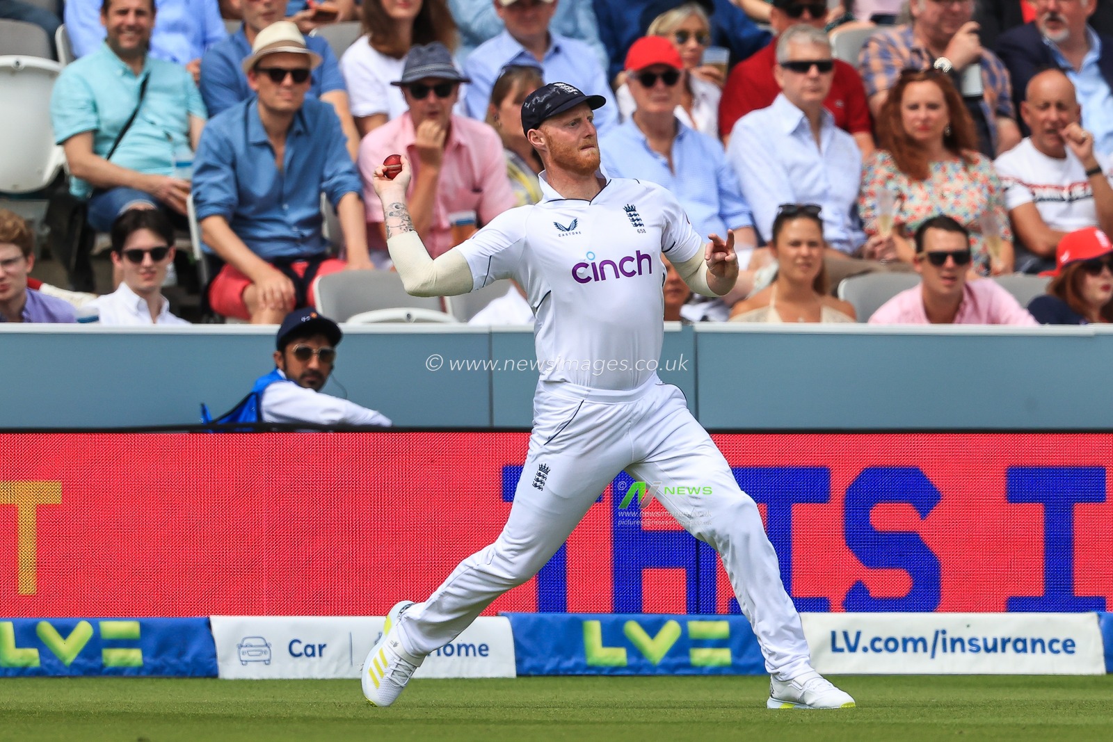 Ben Stokes of England throws the ball back