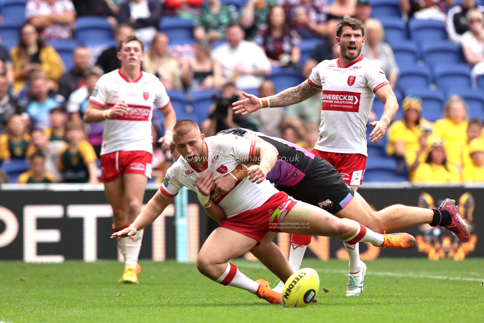 Mikey Lewis of Hull KR is tackled by Jed Cartwright of Hull FC during the Betfred Super League Magic Weekend match Hull KR vs Hull FC at Hill Dickinson Stadium, Liverpool, United Kingdom on 04 July 2026

(Photo by Alfie Cosgrove/News Images)