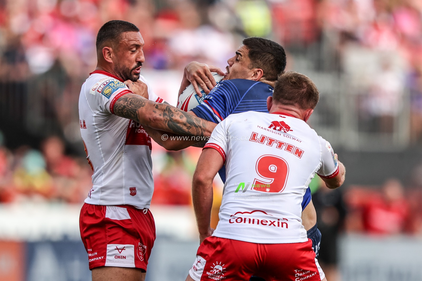 Caleb Hamlin-Uele of Wakefield Trinity is tackled by Elliot Minchella of Hull KR and Jez Litten of Hull KR during the Betfred Super League round 18 match Hull KR vs Wakefield Trinity at Sewell Group Craven Park, Hull, United Kingdom on 11 July 2026

(Photo by Alfie Cosgrove/News Images)