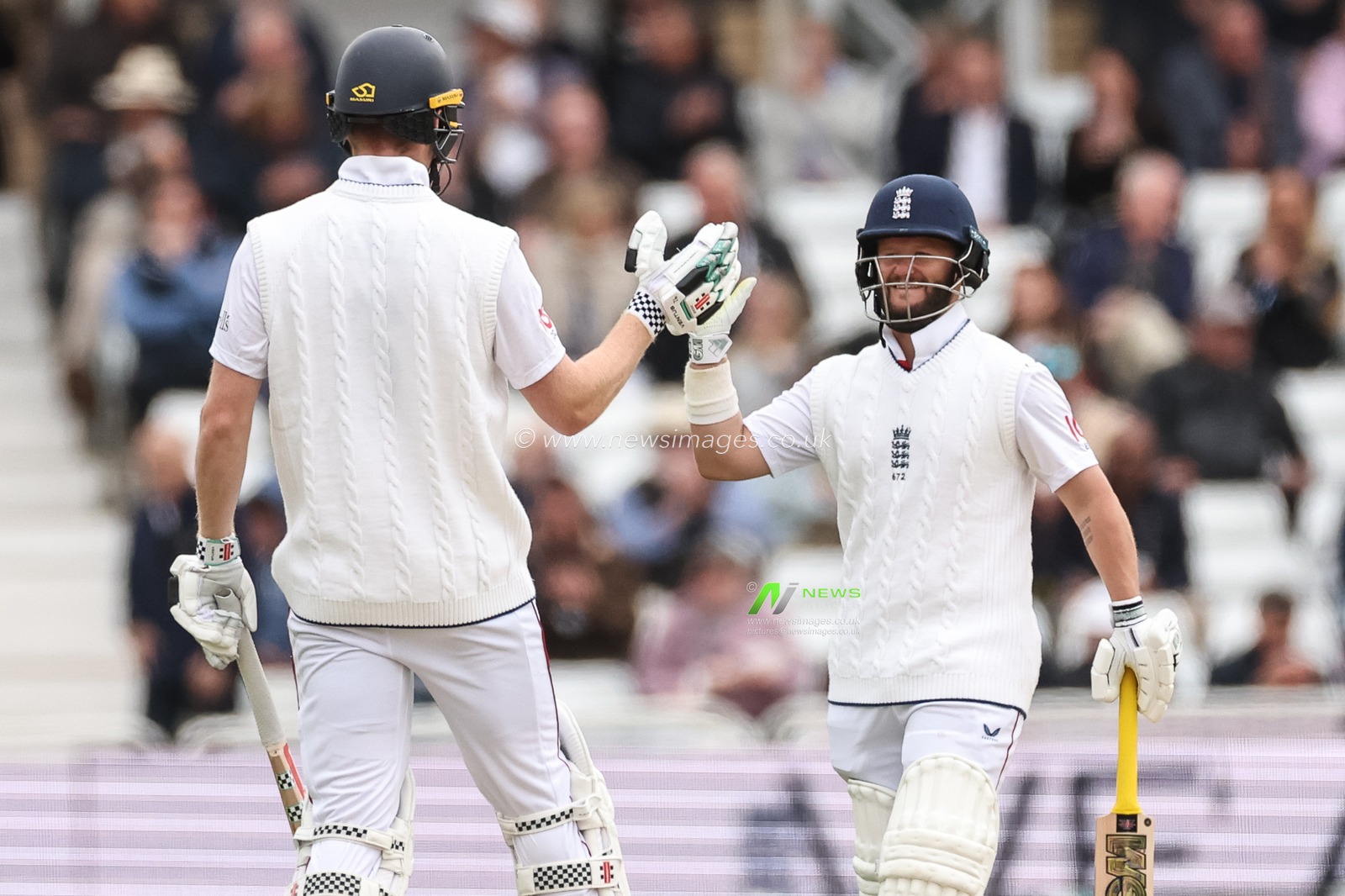 Zak Crawley and Ben Duckett of England high-five as the notch up a 100 partnership during the Rothesay Test Match Day 1 England vs Zimbabwe at Trent Bridge, Nottingham, United Kingdom, 22nd May 2025

(Photo by Mark Cosgrove/News Images)