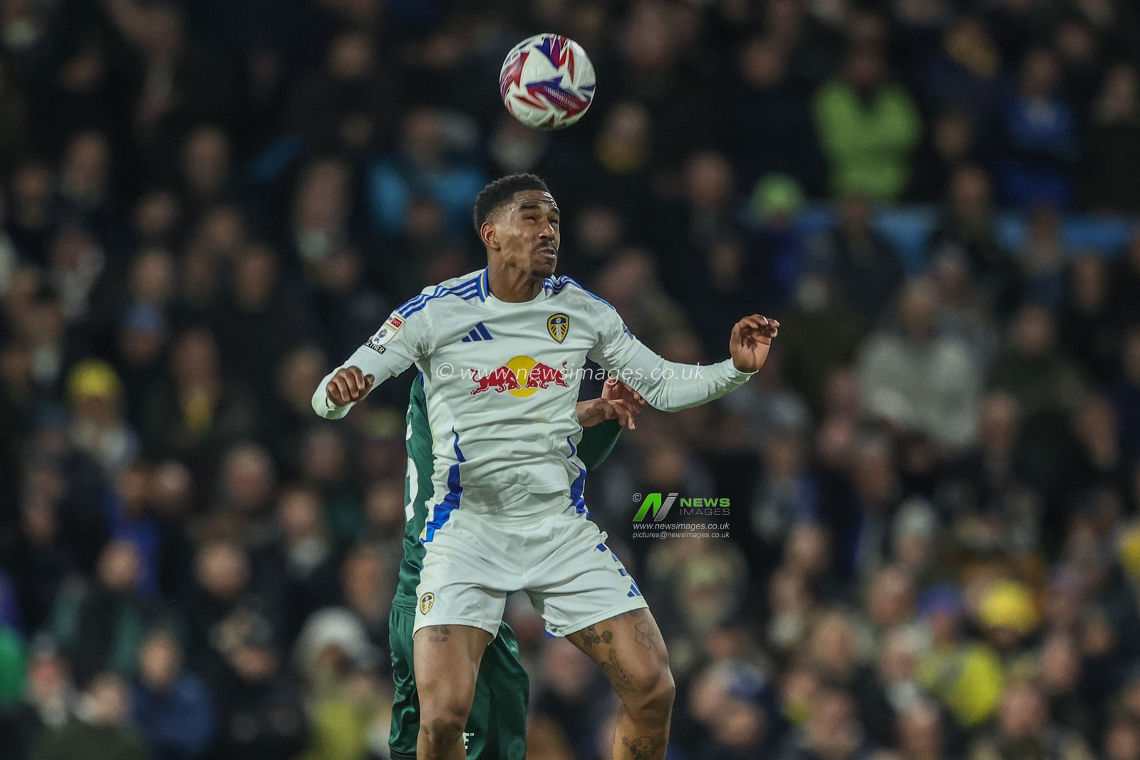 JÃºnior Firpo of Leeds United jumps up to win the high ball during the Sky Bet Championship match Leeds United vs Millwall at Elland Road, Leeds, United Kingdom, 12th March 2025

(Photo by Alfie Cosgrove/News Images)