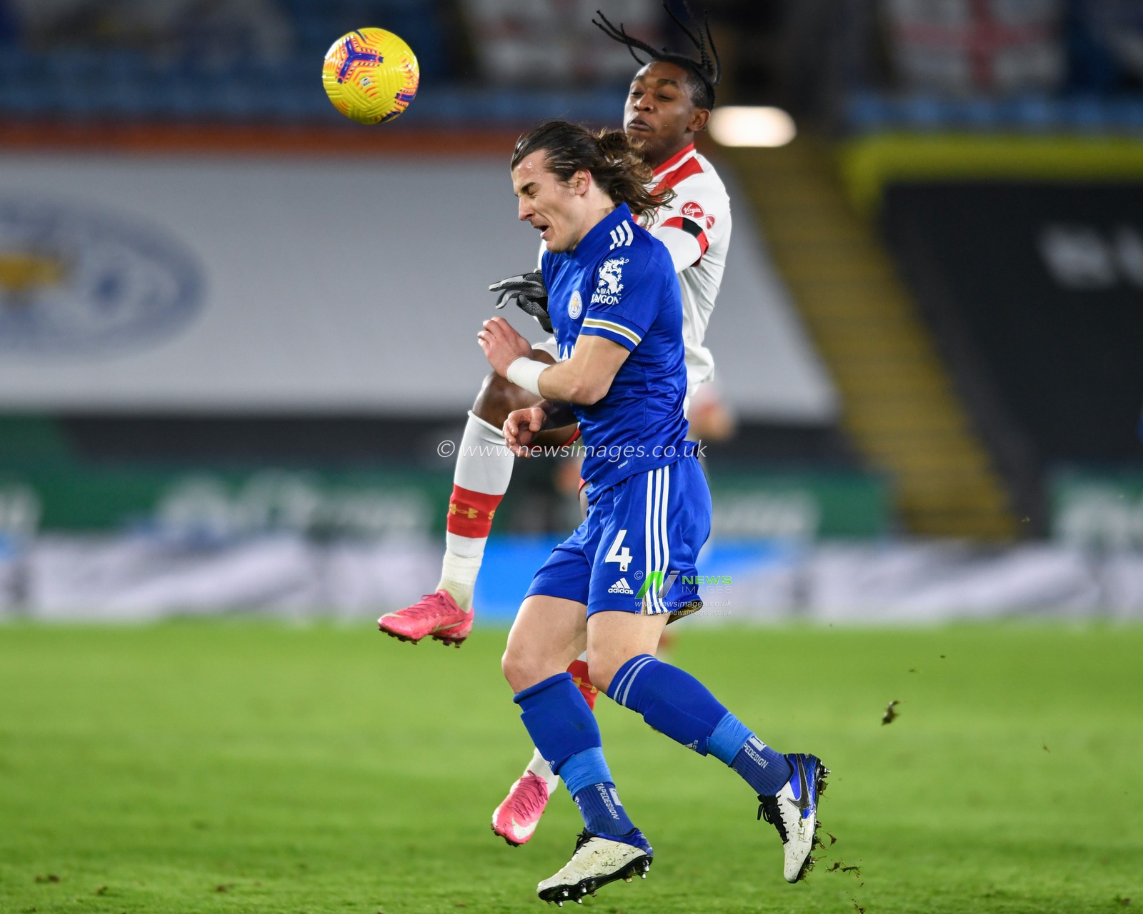 Dan Nâ€™Lundulu #40 of Southampton and Caglar Soyuncu #4 of Leicester City compete for the ball